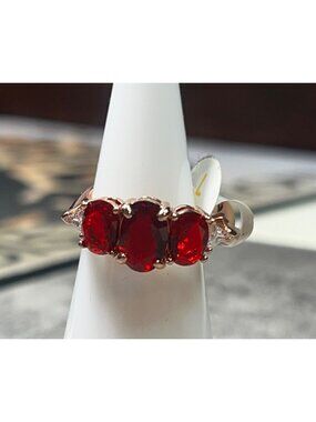 Ring Bomb Party Ring, NWOT, size 7, red stones, gold color band